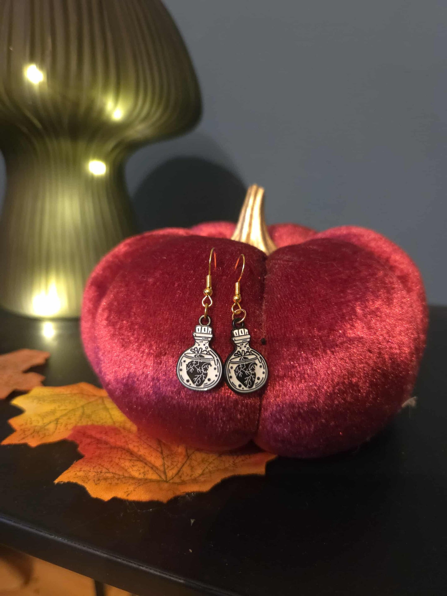 boucles d'oreilles bouteille poison